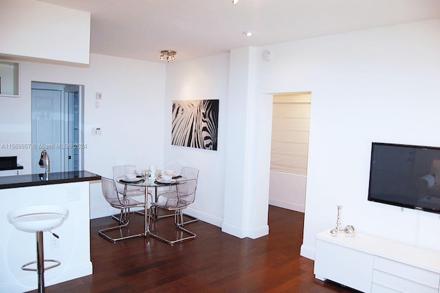 dining area with dark wood-type flooring