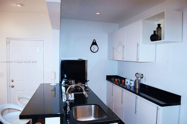 kitchen with white cabinets and sink