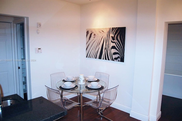 dining room with dark wood-type flooring