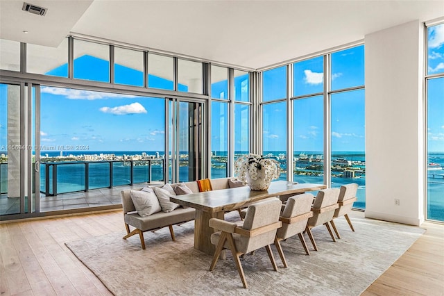 sunroom / solarium with a water view