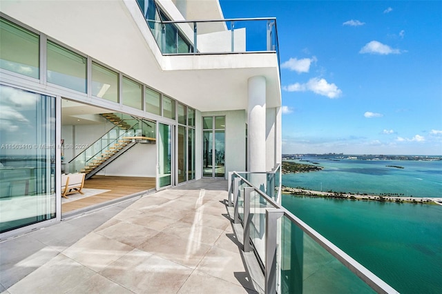 balcony featuring a water view