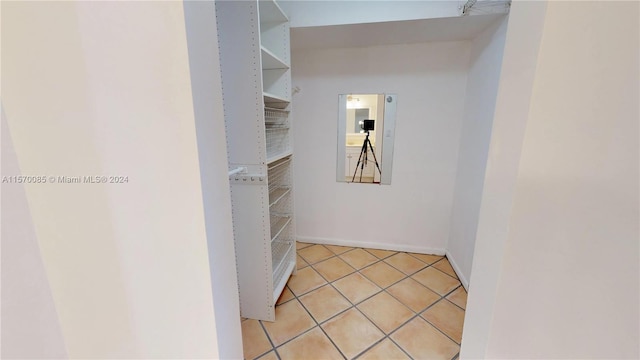 corridor with light tile floors