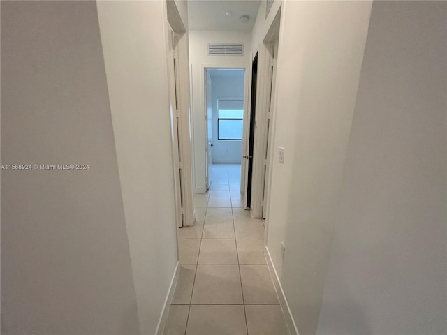 hallway with light tile flooring