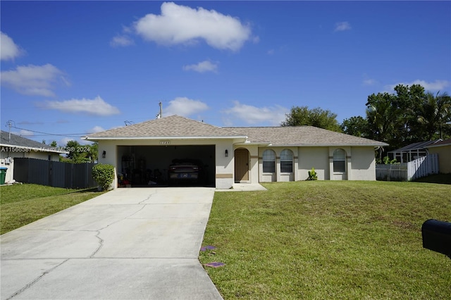 single story home with a garage and a front lawn