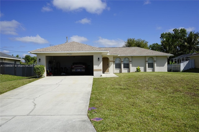 single story home featuring a garage and a front lawn