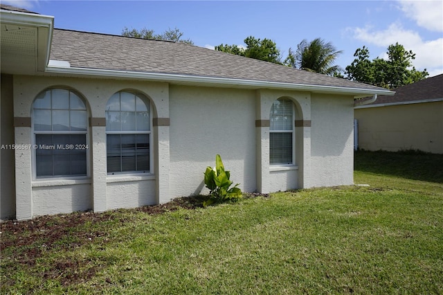 view of home's exterior featuring a lawn