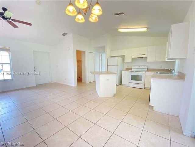 kitchen with white appliances, ceiling fan with notable chandelier, lofted ceiling, white cabinetry, and pendant lighting