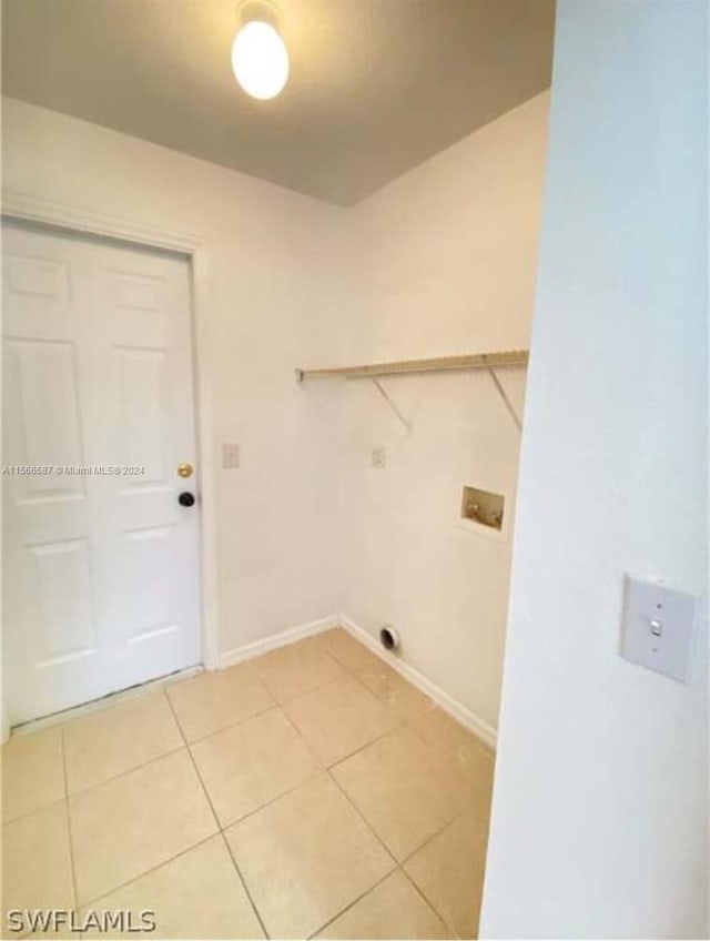 laundry area with light tile flooring and hookup for a washing machine