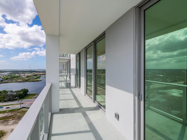 balcony featuring a water view