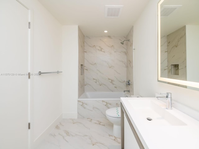 full bathroom featuring tiled shower / bath combo, vanity, tile floors, and toilet