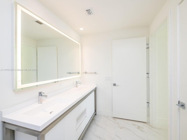 bathroom featuring tile floors and double sink vanity