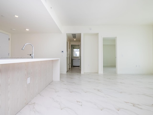 spare room featuring light tile floors