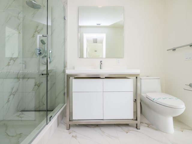 bathroom featuring toilet, tile floors, and vanity