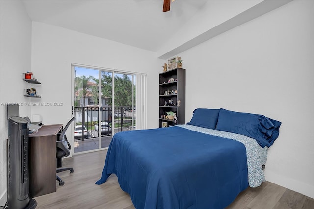 bedroom featuring access to exterior, ceiling fan, and wood-type flooring