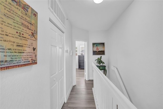 hallway featuring dark hardwood / wood-style flooring