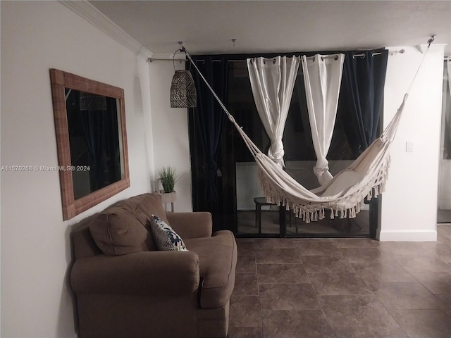 living room featuring tile patterned flooring and ornamental molding