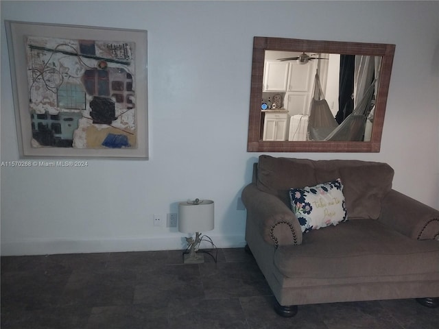 living area with dark tile patterned floors