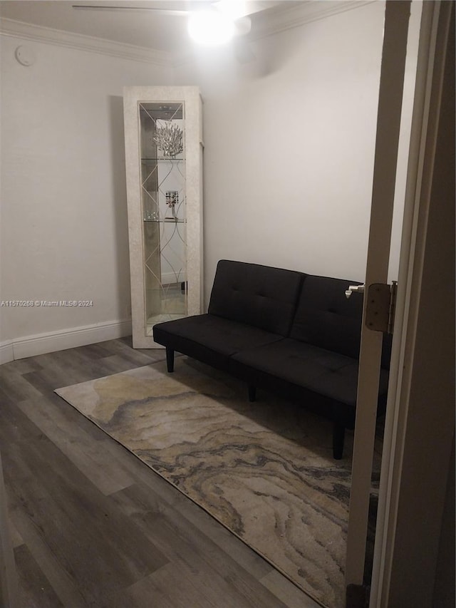 interior space featuring crown molding and hardwood / wood-style flooring