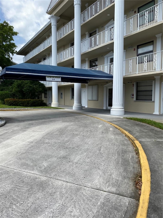 view of property with covered parking
