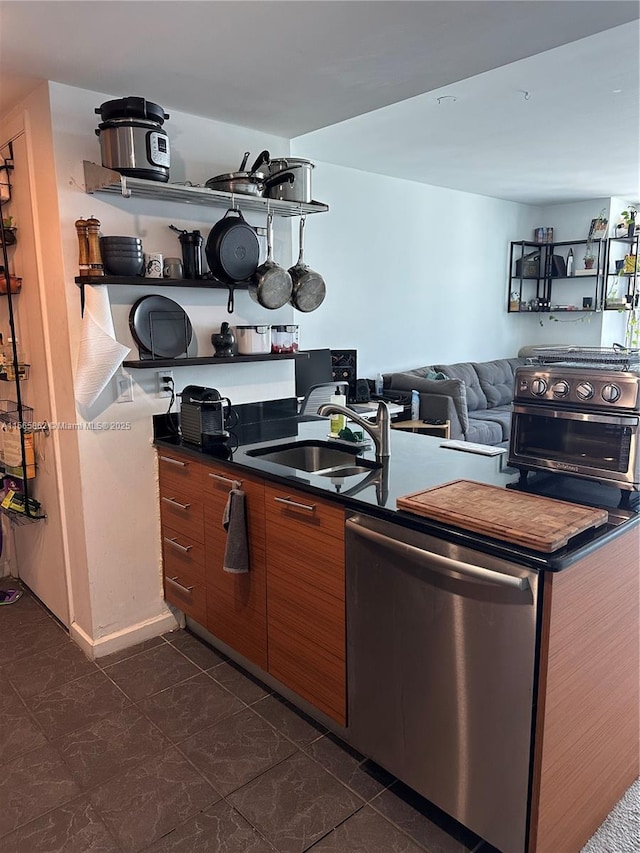 kitchen featuring stainless steel dishwasher and sink