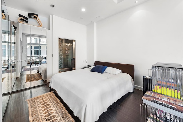 bedroom featuring dark wood-type flooring