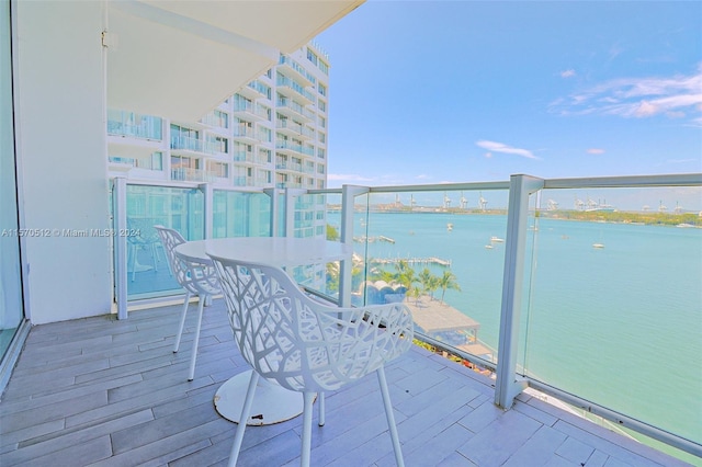 balcony featuring a water view