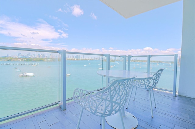 balcony featuring a water view