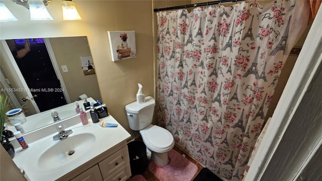 bathroom featuring toilet and vanity