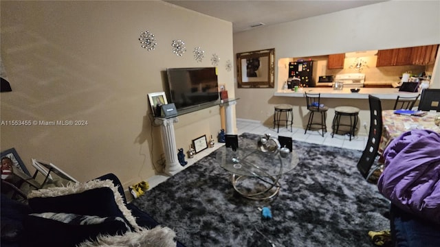 living room featuring light tile floors