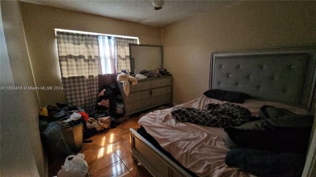 bedroom featuring light tile floors