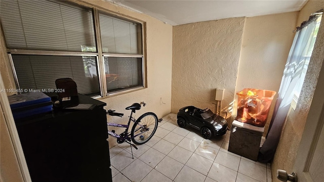 interior space featuring light tile flooring