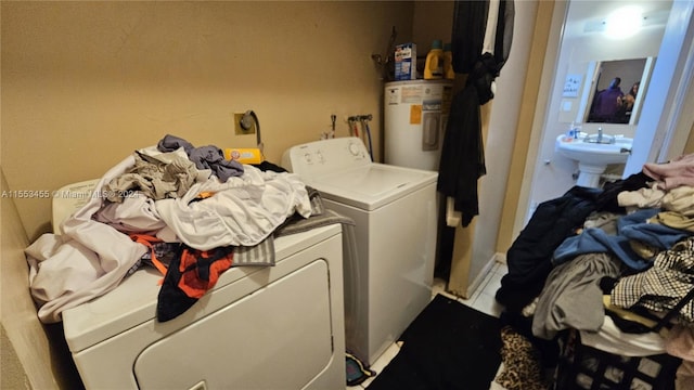 laundry room featuring sink, independent washer and dryer, electric water heater, and electric dryer hookup