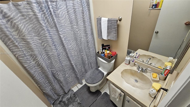 bathroom with tile flooring and large vanity