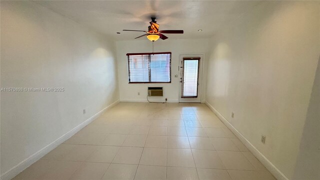 unfurnished living room featuring heating unit, light tile patterned floors, and ceiling fan