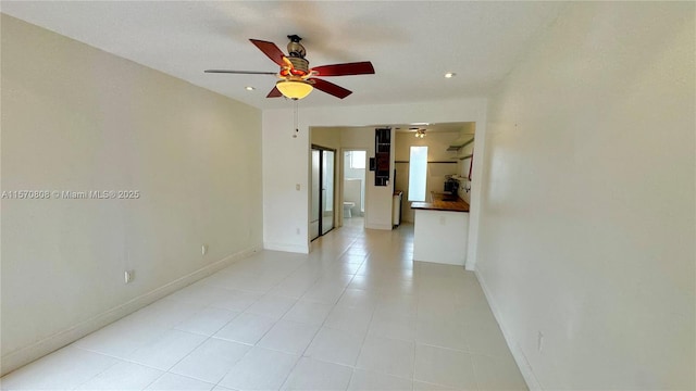 empty room featuring ceiling fan