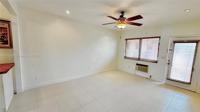 empty room with an AC wall unit and ceiling fan