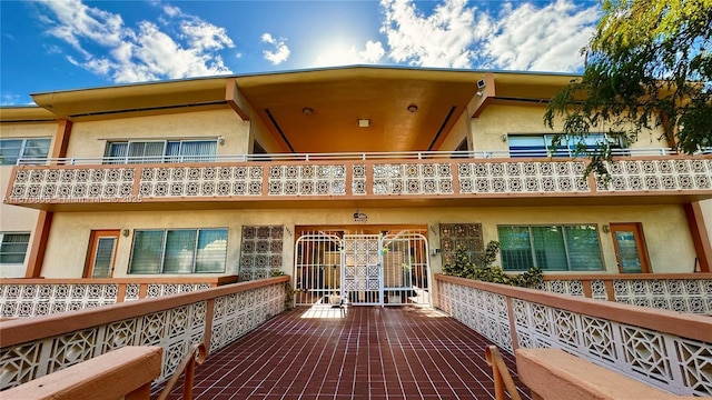 back of house featuring a balcony