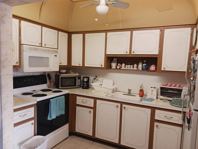 kitchen with white appliances, ceiling fan, light tile floors, and white cabinetry