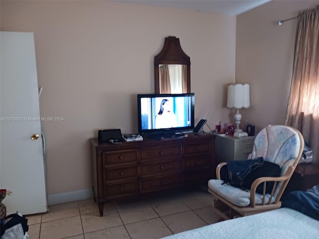 bedroom featuring light tile flooring