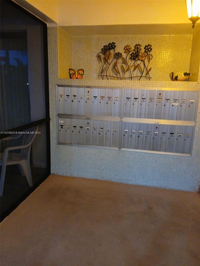 interior space featuring carpet floors and mail boxes