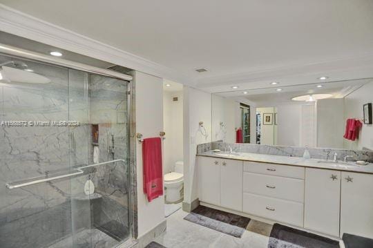 1121 Crandon Blvd Unit F906, Key Biscayne, FL 33149 - full bathroom featuring a sink, double vanity, a marble finish shower, toilet, and recessed lighting