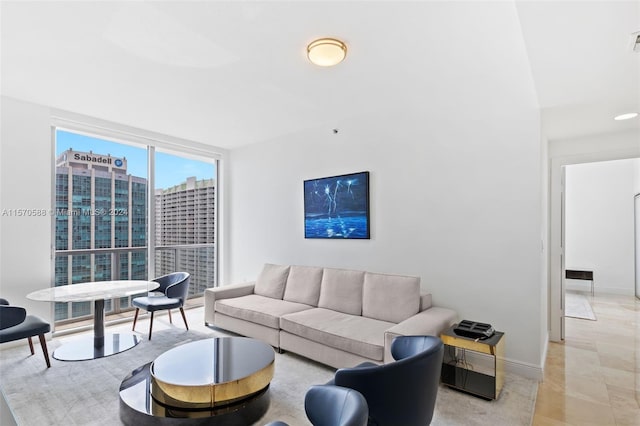 tiled living room featuring expansive windows