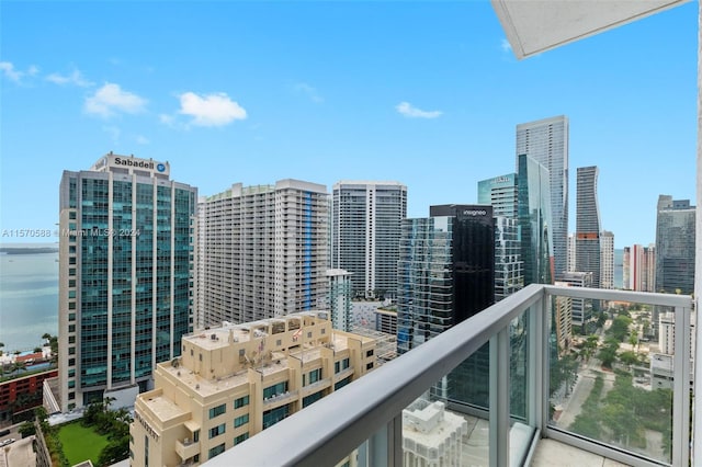 balcony featuring a water view