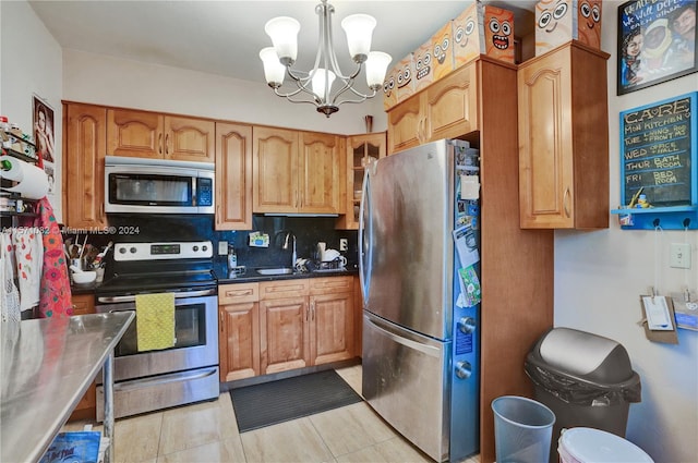 kitchen featuring backsplash, light tile flooring, decorative light fixtures, a chandelier, and stainless steel appliances