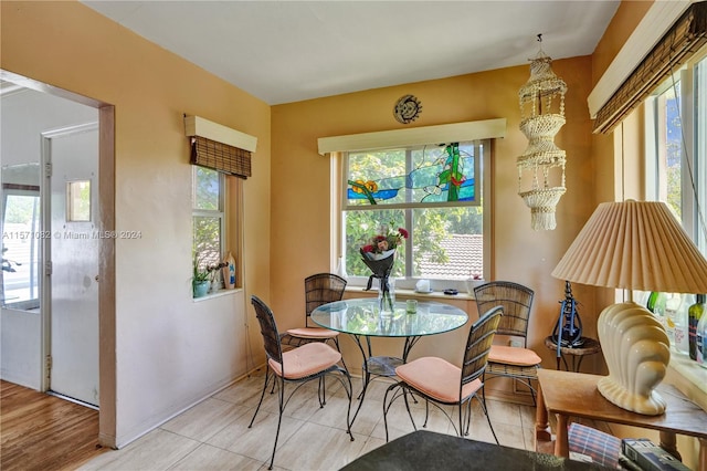 dining space featuring light hardwood / wood-style flooring and plenty of natural light