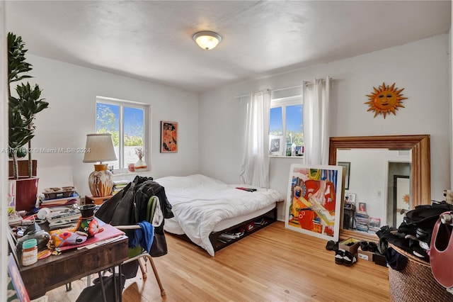 bedroom with light hardwood / wood-style flooring