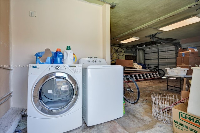 washroom featuring washing machine and dryer