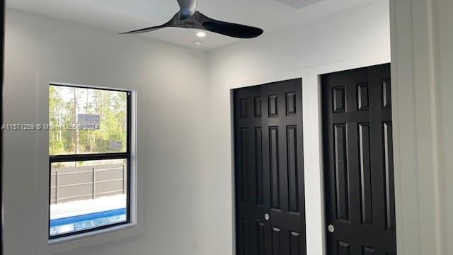 entrance foyer featuring ceiling fan