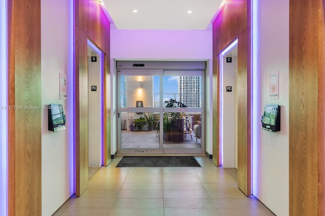 hallway featuring light tile floors