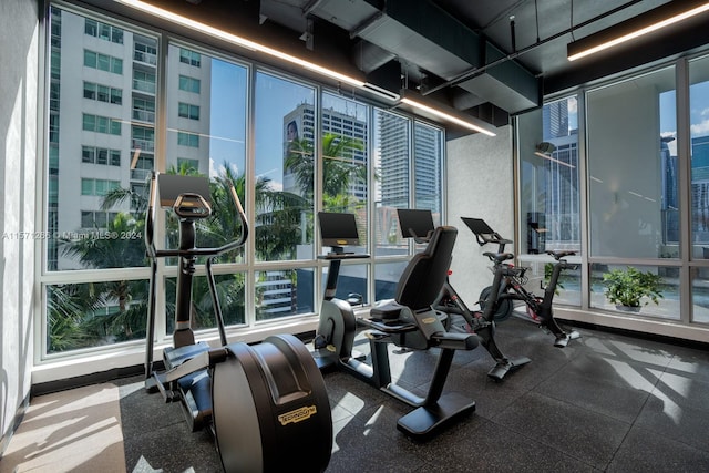 exercise room with floor to ceiling windows